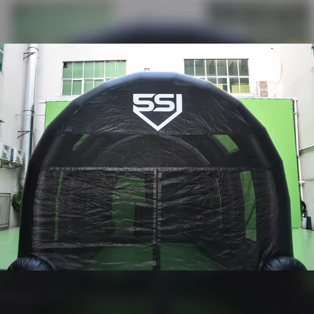 Front view of a Lab batting cage unit with the mesh screen closed over the entrance.